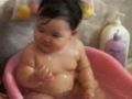 chubby baby takes a bath